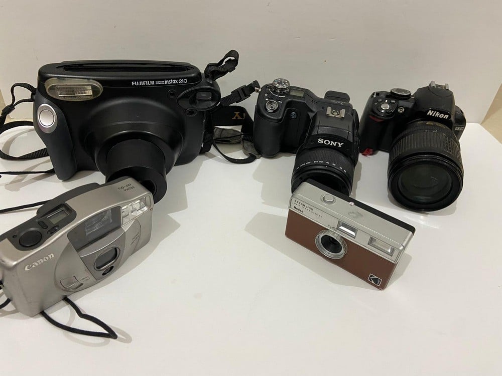 A Collection Of Old And Used Cameras - 4