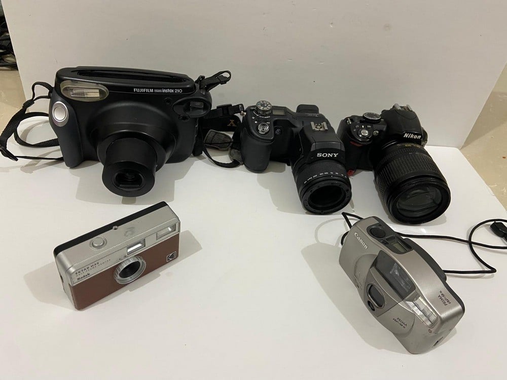A Collection Of Old And Used Cameras - 2