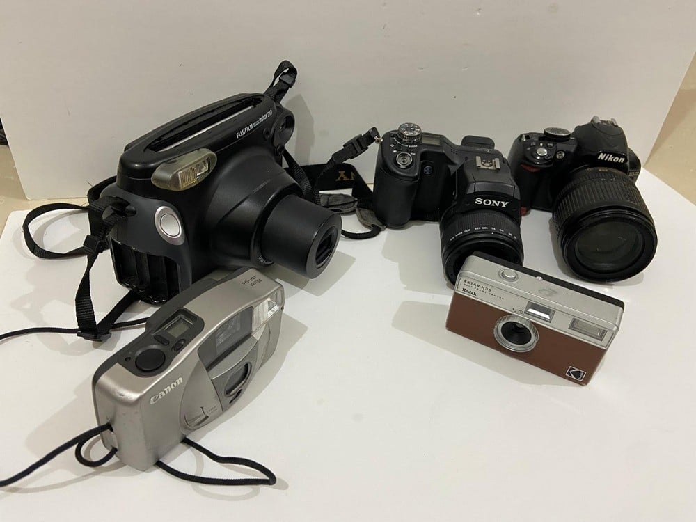 A Collection Of Old And Used Cameras - 1