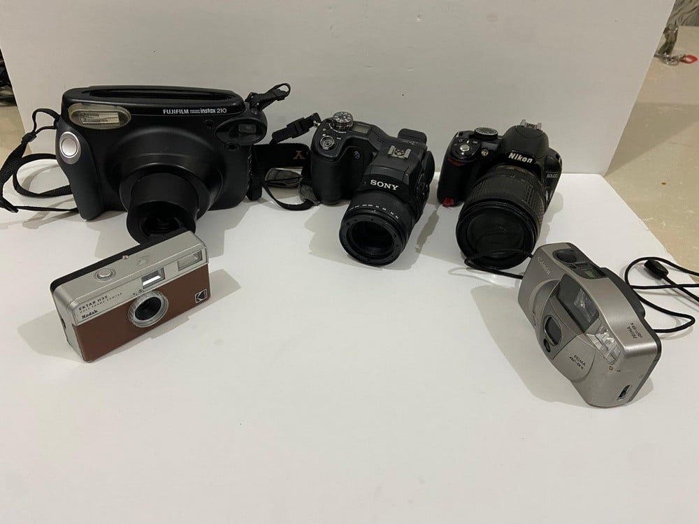 A Collection Of Old And Used Cameras - 3