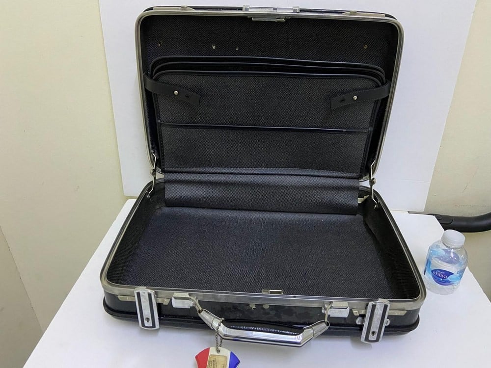 A small vintage hard-shell suitcase from American Tourister - 1