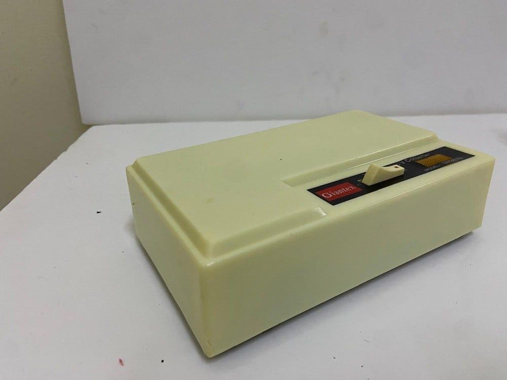 Old TV and channel converter (UHF to VHF TV/VCR Converter) by Giantex, model UV387, with its original box. - 5