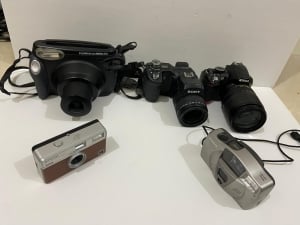 A Collection Of Old And Used Cameras - 2