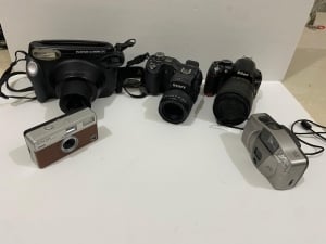 A Collection Of Old And Used Cameras - 3