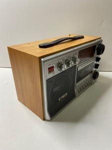 An Old Radio And Cassette Player With A Wooden And Silver Design - 4