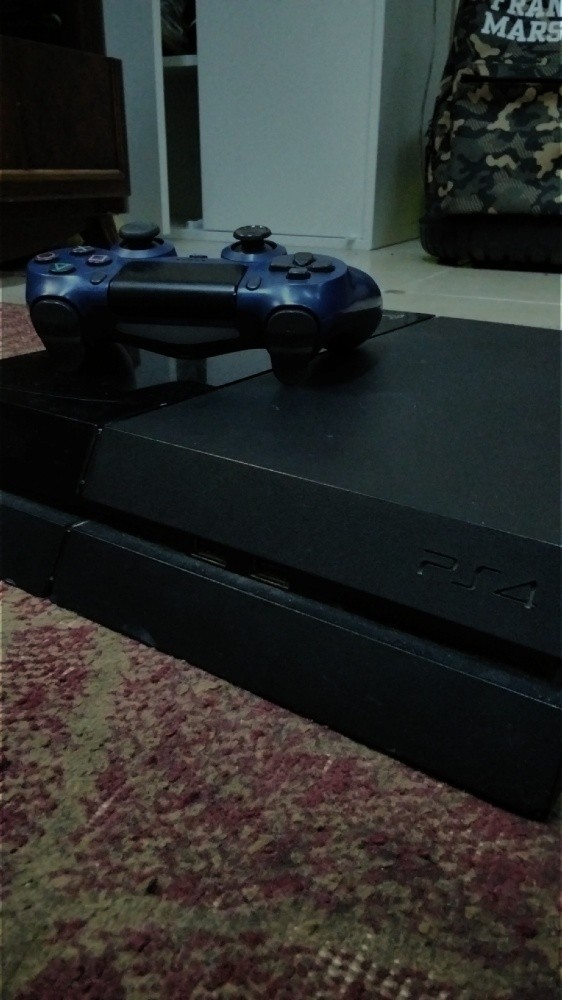 playstation 4 with a joystick. - 1