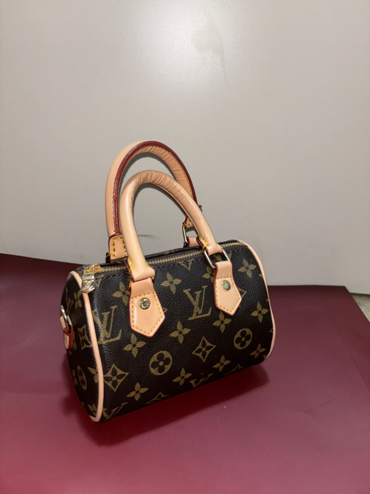 ‏Louis Vuitton mini bag - 1