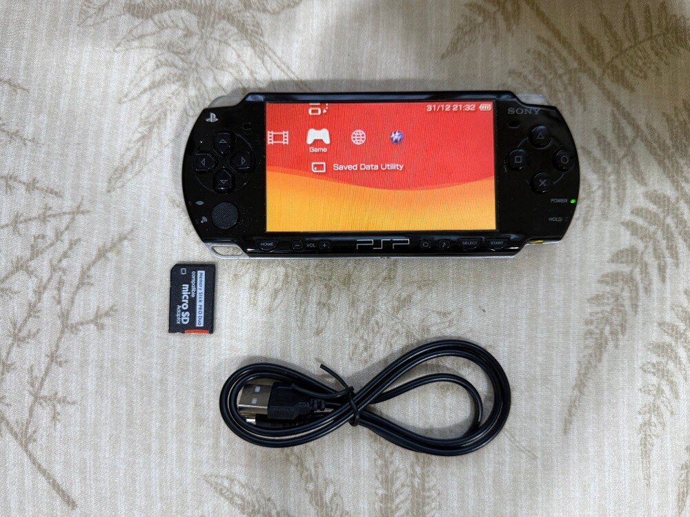 psp with battery and 50 games - 1