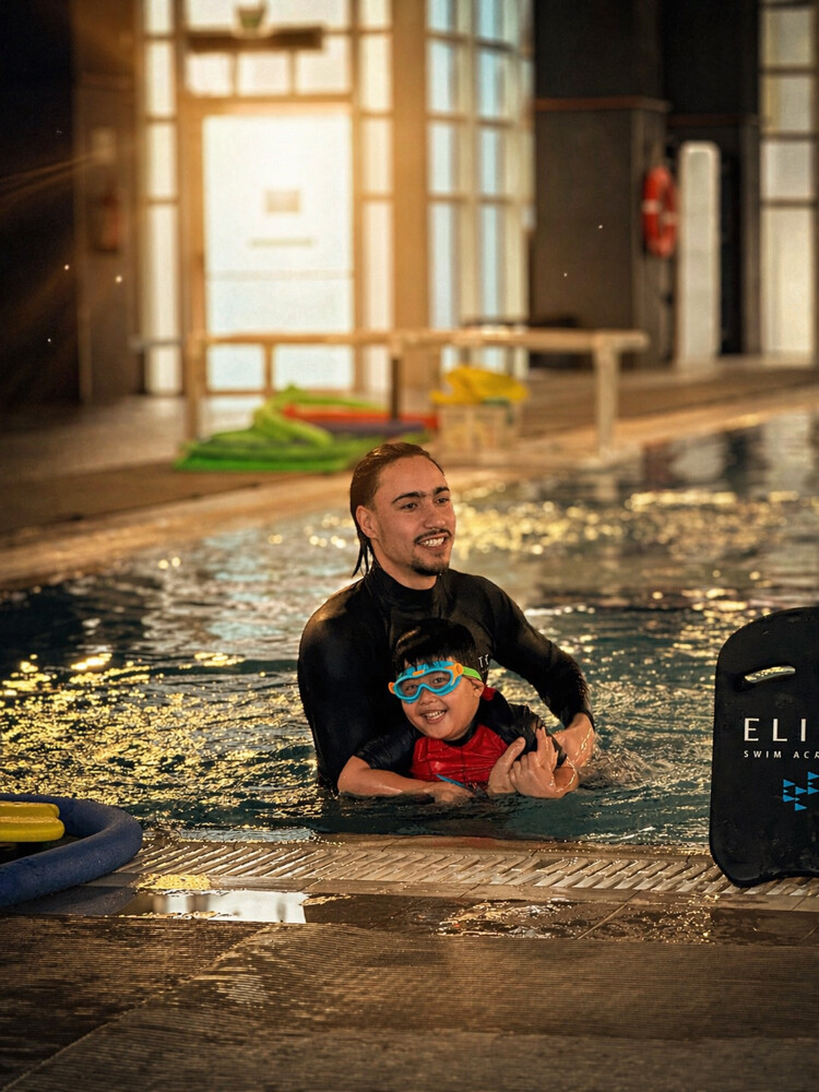 professional swimming coach ‏ - 1