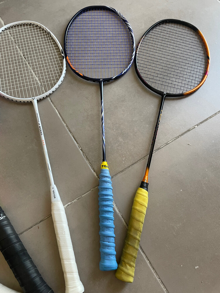 three badminton rackets  - 1