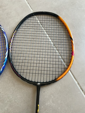 three badminton rackets  - 4