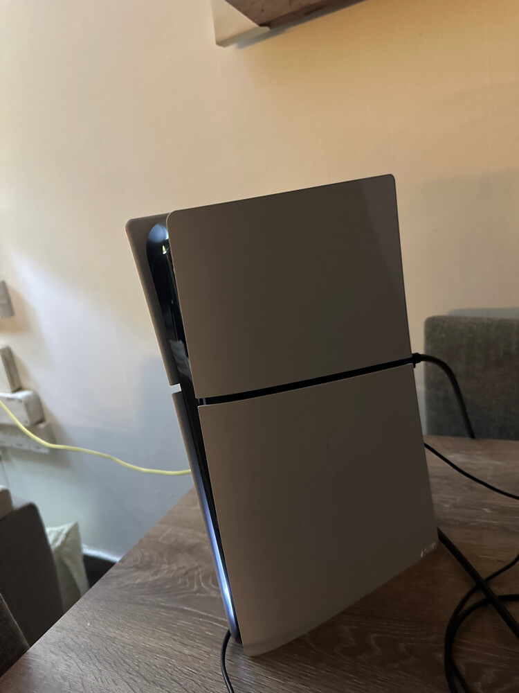 PlayStation 5 and laptop - 1