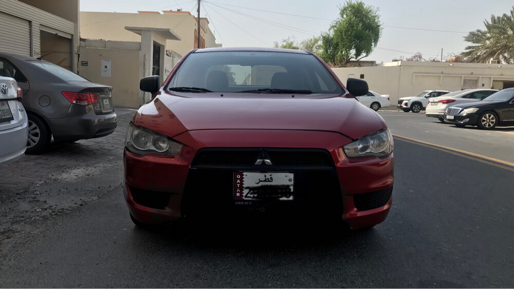 لانسر 2015 لون عنابي  - 2