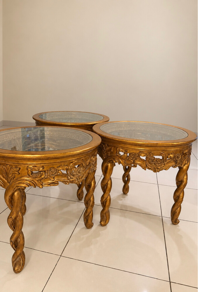 Classic living room set featuring chairs, decorative glass tables, and a classic console/washstand with a mirror. - 2