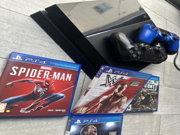 PS4 (1 TB) + 2 controllers & games - 3