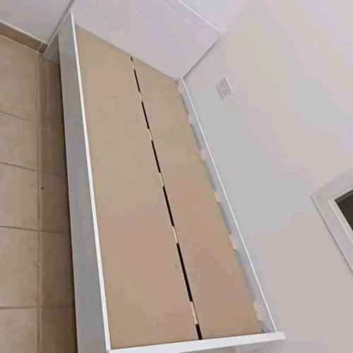 Single white wooden bed