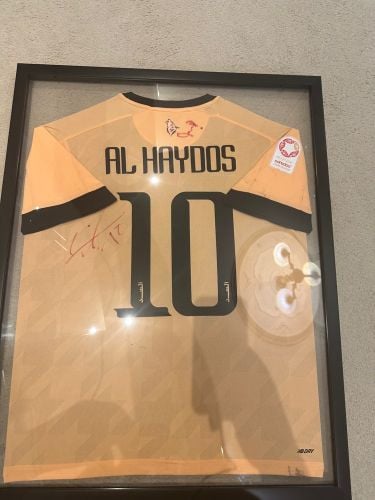 Al haidous worn match sign shirt 