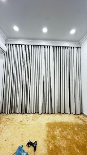 Sheer white curtains, gold tiebac