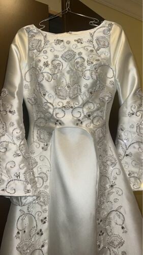 white dress embroided with beads 
