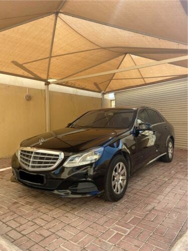 Mercedes E200 black lady driven 