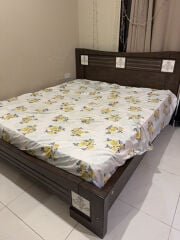 bed with mattress and side table