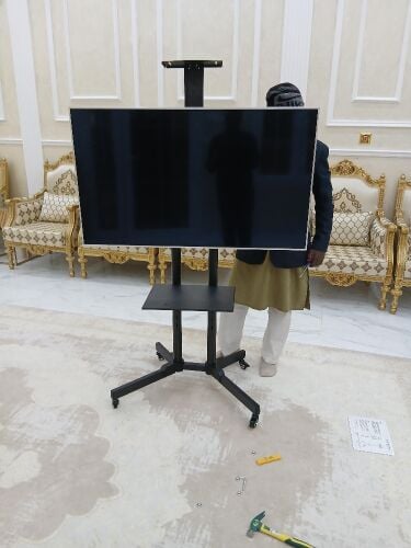 Tv stand with portable trolleys