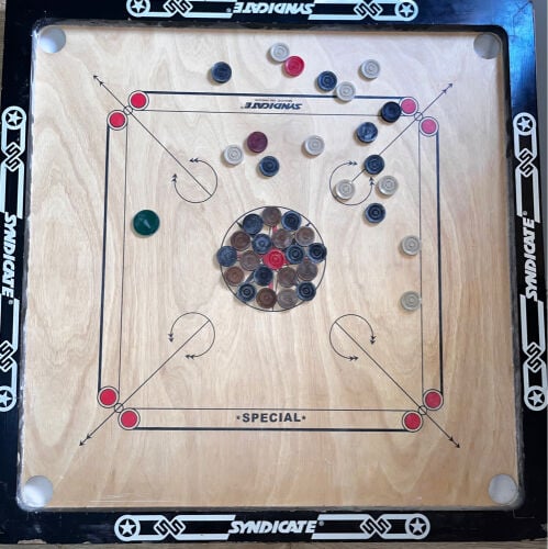 carrom board with coins