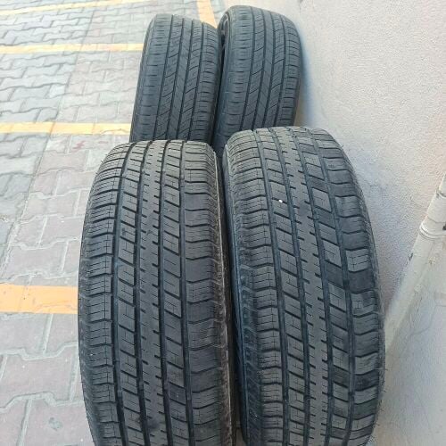 Six used tires with rims