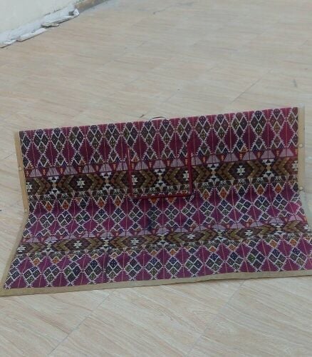 A rug with colorful traditional nau