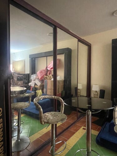 A large wardrobe full of mirrors