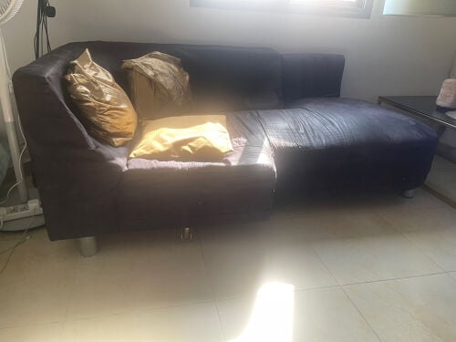L shaped black sofa with two pillow