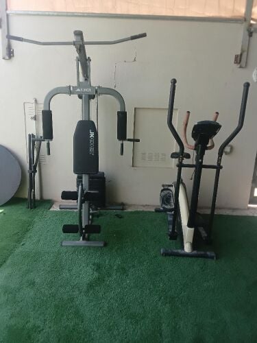 جهاز رفع اثقال مع عجلة رياضية