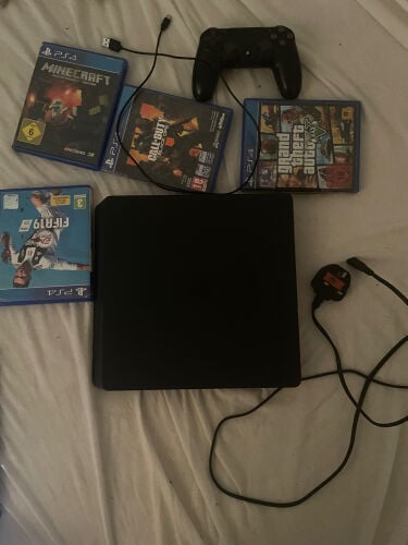 ps4 with controller and 4 cds