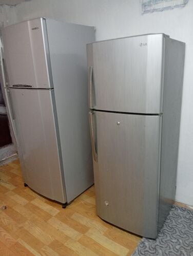 Two Toshiba family refrigerators, l