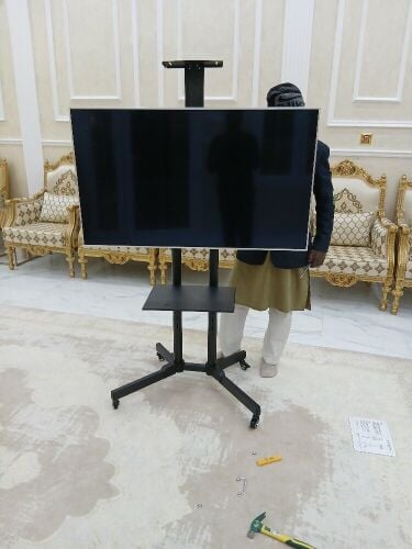 Tv stand with portable trolleys