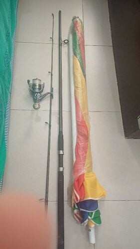 Fishing rod with reel and sun umbre
