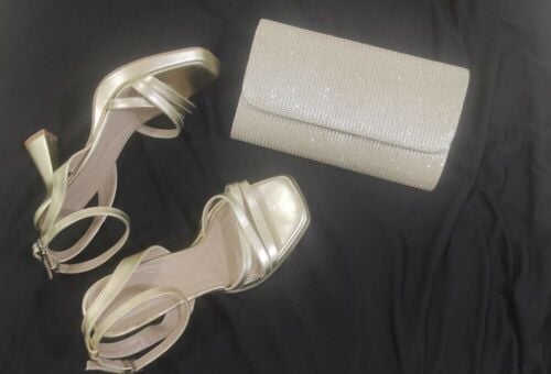 golden high heels and clutch