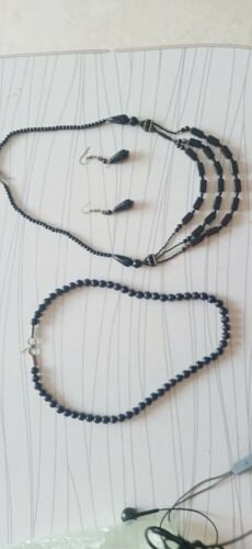 Necklace, earrings.