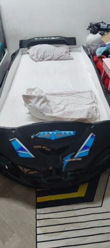 Car-shaped baby crib with mattress