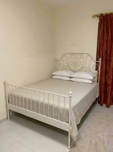 White double bed with mattress