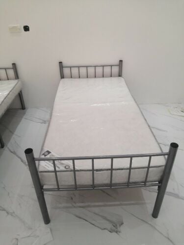 silver single bed with mattress
