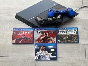 PS4 (1 TB) + 2 controllers & games