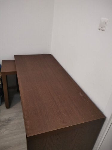 A bed, a dresser, a bed, a table or