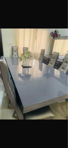 Dining table with mirrors and a boo