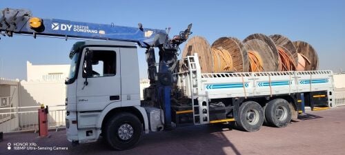 10 TAN BOOM TRUCK CRAIN FOR RENT
