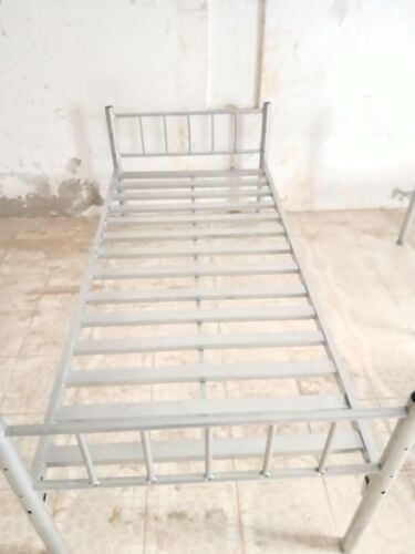Three silver bed frame and one blac